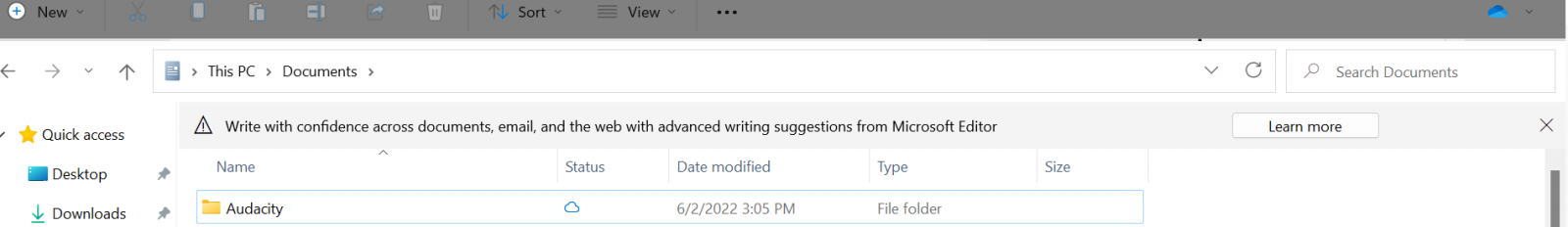 A screenshot of Windows Explorer. Above the list of files, an important-looking banner with a triangle exclamation mark alert symbol reads "Write with confidence across documents, email, and the web with advanced writing suggestions from Microsoft Editor".